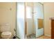 This bathroom offers a glass-enclosed shower with pebble floor and classic fixtures at 4522 Weeping Willow Cir, Casselberry, FL 32707