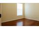 This cozy bedroom features beautiful hardwood floors and a bright window at 4522 Weeping Willow Cir, Casselberry, FL 32707