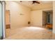 Spacious living room with vaulted ceiling, tile flooring, and access to other rooms at 4522 Weeping Willow Cir, Casselberry, FL 32707