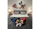 Kid-friendly bedroom featuring whimsical Mickey Mouse decor and cozy bedding at 4800 Lullaby Ln, Kissimmee, FL 34746