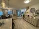 Bright, open-concept living space with stylish decor, tile floors, and a modern design, creating a welcoming atmosphere at 4800 Lullaby Ln, Kissimmee, FL 34746