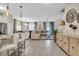 Bright, open living space with stylish pendant lighting, an inviting sectional sofa, and elegant furnishings, creating a warm ambiance at 4800 Lullaby Ln, Kissimmee, FL 34746