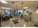 Open-concept living space featuring a modern kitchen island, dining area, and comfortable living room at 4800 Lullaby Ln, Kissimmee, FL 34746