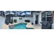 Beautiful backyard pool area with a screened-in patio, lounge chairs, and outdoor dining, perfect for relaxing or entertaining at 4800 Lullaby Ln, Kissimmee, FL 34746