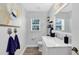 Bathroom with white vanity, marble countertop, modern fixtures, and decorative towel hooks at 5297 Mill Stream Dr, St Cloud, FL 34771