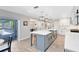 Spacious kitchen island with pendant lighting, stainless steel sink and gray cabinets at 5297 Mill Stream Dr, St Cloud, FL 34771