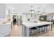 Bright, open kitchen features a large island with bar seating and stainless steel appliances at 5297 Mill Stream Dr, St Cloud, FL 34771
