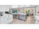 A modern kitchen with a view into the backyard and stainless steel appliances at 5297 Mill Stream Dr, St Cloud, FL 34771