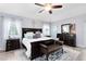 Bright main bedroom suite with neutral decor, ceiling fan and wooden furniture at 5297 Mill Stream Dr, St Cloud, FL 34771