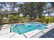 Inviting screened-in pool area with spa and clear blue water, complete with a lovely, covered lanai at 5297 Mill Stream Dr, St Cloud, FL 34771