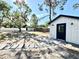 Landscaped backyard with shed and stepping stone path at 560 Garden Heights Dr, Winter Garden, FL 34787
