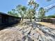 Spacious backyard featuring a storage shed and a stepping stone walkway at 560 Garden Heights Dr, Winter Garden, FL 34787