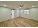 Bedroom with wood-look floors, neutral paint, recessed lighting, and a unique barn door at 560 Garden Heights Dr, Winter Garden, FL 34787