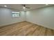 Bedroom with wood-look floors, neutral paint, recessed lighting, and a bright window at 560 Garden Heights Dr, Winter Garden, FL 34787