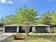Charming single-story home with a well-maintained lawn and attractive landscaping at 560 Garden Heights Dr, Winter Garden, FL 34787