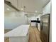 Well-lit kitchen with a large island, stainless steel appliances, and modern pendant lighting at 560 Garden Heights Dr, Winter Garden, FL 34787