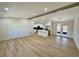 Open-concept living area with wood flooring, recessed lighting, and access to the kitchen at 560 Garden Heights Dr, Winter Garden, FL 34787