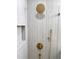 This shower features neutral toned walls, gold hardware, and a built in shelf at 560 Garden Heights Dr, Winter Garden, FL 34787