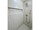 This shower features neutral toned walls, gold hardware, and a built in shelf at 560 Garden Heights Dr, Winter Garden, FL 34787