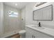 Bright bathroom with white cabinets, modern fixtures, and a tiled walk-in shower at 5612 Meridian Way, Orlando, FL 32808