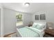 Comfortable bedroom with neutral tones, natural light, and a plush bed with decorative pillows and lamps at 5612 Meridian Way, Orlando, FL 32808