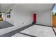Carport with a red door leading to the interior of the house at 5612 Meridian Way, Orlando, FL 32808