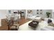 Stylish living space featuring modern furniture, hardwood floors, and an open concept dining and kitchen at 5612 Meridian Way, Orlando, FL 32808