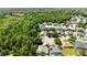 Aerial view of a neighborhood with mature landscaping, single Gathering homes, and lush green spaces at 5815 Pine Grove Run, Oviedo, FL 32765