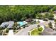 Areal view of the in-ground pool, the picnic pavilion, the road, and the neighborhood at 5815 Pine Grove Run, Oviedo, FL 32765