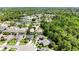 Beautiful aerial view of a residential community with lush landscaping, a tranquil pond, and well-maintained homes at 5815 Pine Grove Run, Oviedo, FL 32765