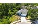 Aerial view of a blue single Gathering home with well-manicured landscaping in a lush neighborhood at 5815 Pine Grove Run, Oviedo, FL 32765