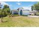 A single-Gathering home featuring manicured landscaping, a two-car garage, and inviting curb appeal at 5815 Pine Grove Run, Oviedo, FL 32765