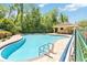 Inviting community pool with a picnic pavilion, lush landscaping, and an inground pool at 5815 Pine Grove Run, Oviedo, FL 32765