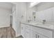 Elegant bathroom featuring double vanity, white cabinets, and modern fixtures at 601 Marion Oaks Blvd, Ocala, FL 34473