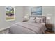 Inviting bedroom with large window, neutral tones and a serene atmosphere at 601 Marion Oaks Blvd, Ocala, FL 34473
