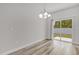 Minimalist dining area with sliding doors to the backyard, offering a bright and airy space at 601 Marion Oaks Blvd, Ocala, FL 34473