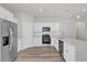 Modern kitchen featuring stainless steel appliances, sleek white cabinetry, and a functional design at 601 Marion Oaks Blvd, Ocala, FL 34473
