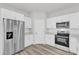 Corner kitchen showcases stainless steel refrigerator and oven with white cabinets and stone countertops at 601 Marion Oaks Blvd, Ocala, FL 34473