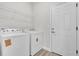 Functional laundry room features side-by-side washer and dryer units plus shelving at 601 Marion Oaks Blvd, Ocala, FL 34473