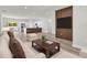 Stylish living room featuring modern furnishings, sleek floors, and an open-concept layout connecting to the kitchen at 601 Marion Oaks Blvd, Ocala, FL 34473