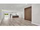 Bright, open living area boasts stylish flooring and flows seamlessly into a modern kitchen at 601 Marion Oaks Blvd, Ocala, FL 34473
