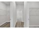 Large walk-in closet includes open shelving and modern wood-look flooring creating a stylish storage space at 601 Marion Oaks Blvd, Ocala, FL 34473