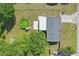 Aerial view of backyard showcasing large above ground pool and well maintained yard at 62 Magnolia Dr, Debary, FL 32713