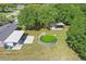 Aerial view of the backyard featuring an above-ground pool, shed, and expansive grassy space at 62 Magnolia Dr, Debary, FL 32713
