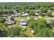 Aerial view showcasing the home, backyard pool, shed, and surrounding neighborhood at 62 Magnolia Dr, Debary, FL 32713