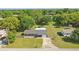 Aerial view of home featuring a well-manicured lawn and expansive backyard at 62 Magnolia Dr, Debary, FL 32713