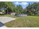 Expansive backyard with an above-ground pool, patio, and storage shed, ideal for outdoor enjoyment at 62 Magnolia Dr, Debary, FL 32713