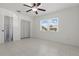 Bedroom with tile flooring, closet, and ample natural light from the window at 62 Magnolia Dr, Debary, FL 32713
