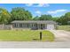 Well-kept single-story home featuring a lush green lawn, tidy landscaping, and a functional mailbox at 62 Magnolia Dr, Debary, FL 32713
