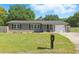 Charming single-story home with a well-maintained lawn, mailbox, and inviting curb appeal at 62 Magnolia Dr, Debary, FL 32713